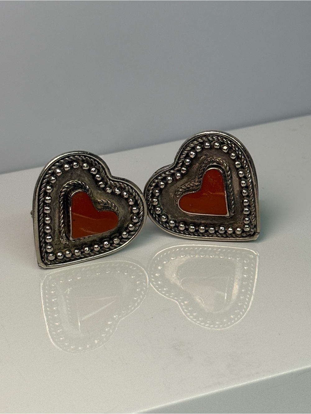 🚨3 for $15🚨 Heart-Shaped Silver Tone Clip On Earrings with Red Inlay
